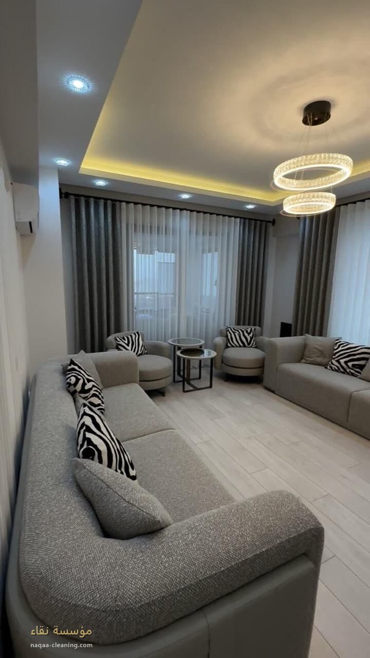 Sofas and majlis seating in a living room after cleaning